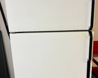 Beer fridge.  If you don't have one, the neighbors are talking about you.