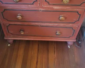 antique European pine dresser with a distressed red paint 