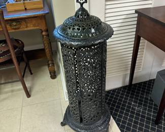 Godin ornate pierced cast iron enameled cylindrical radiator cover.