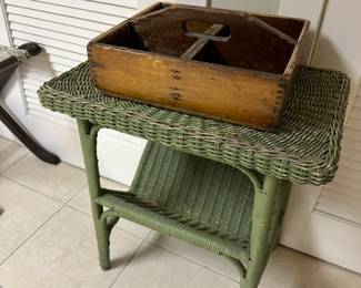 Vintage rattan magazine table with antique wooden handled carrier.