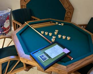 Octagonal game table with four chairs. Top can be flipped to switch between dining, poker, or bumper pool. Alternate view.