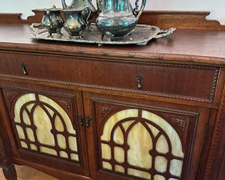 Antique sideboard with stained glass panels. Alternate view.