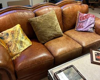 Leather sofa with nailhead trim and rolled arms. Alternate view.