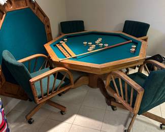 Octagonal game table with four chairs. Top can be flipped to switch between dining, poker, or bumper pool. Alternate view.