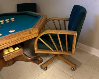 Octagonal game table with four chairs. Top can be flipped to switch between dining, poker, or bumper pool. Alternate view.