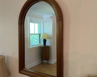 Antique solid wood arched mirror.