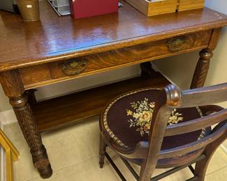 Antique oak desk with petti point upholstered chair.
