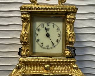 Antique clock with gold gilding.