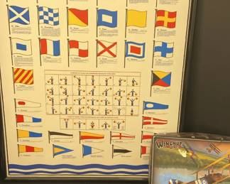 Framed Piece Displaying International Naval Signal Flags, Nine Muzzle Blast Magazines, Model Plane