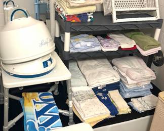 Bathroom towels, vintage wicker wall hangings, wicker laundry basket