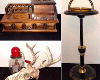 Vintage dresser box with a roll top,
Dazey Dandy glass butter churn, deer skull with antlers, and a vintage standing ashtray with amber glass ashtray