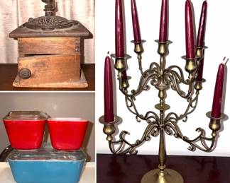 A vintage hand-crank coffee grinder, brass candelabra, and vintage Pyrex glass dishes.