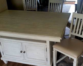 white counter-height dining set with a table and four chairs