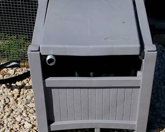 Suncast hose reel, a type of garden hose storage box.