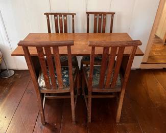 Arts and Crafts oak table and chairs, antique Oriental rug upholstery