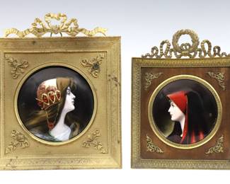 Hand-enameled portraits, one of "Saint Fabiola" after Jean-Jacques Henner, and the other of a young women in a headdress. Presented in Gilded metal frames with engraved decoration and cast vintage ribbons. St. Fabiola signed "Jacques Henner" and artist monogrammed "HR", the other monogrammed "AP". Slight surface wear, some wear to frame's Gilded finish. Plaques up to 4" diameter, framed up to 6 1/2 x 7 1/2" high overall.