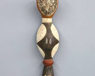 An African Baga snake ceremonial headdress. Carved wooden figure with polychrome geometric decoration. Some wear to decoration. 22" high.