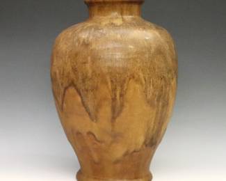 An early to mid 20th century Pewabic Art Pottery vase. Baluster form with high shoulder and matte drip glaze in shades of mottled Brown. Impressed "Pewabic Detroit" mark. Minor wear and crazing. 10 1/4" high.