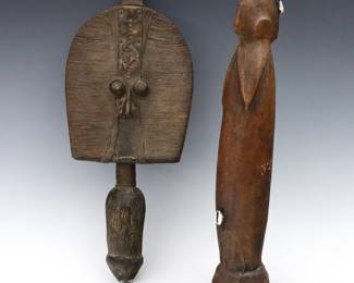 Two African ritual figures. Includes a Boho Na Bwete reliquary figure from the Mahongwe people of Gabon with a carved wooden body clad in Copper and Brass, and a Biiga fertility doll from the Mossi people of Burkina Faso with a carved wooden body clad in leather with cowrie shell accents. Some wear. Up to 17 1/2" high.