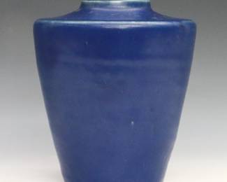 An early to mid 20th century Pewabic Art Pottery vase. Tapered form with a high, flat shoulder and matte glaze in Cobalt Blue. Impressed "Pewabic Detroit" mark. Minor wear and crazing. 5 3/4" high.