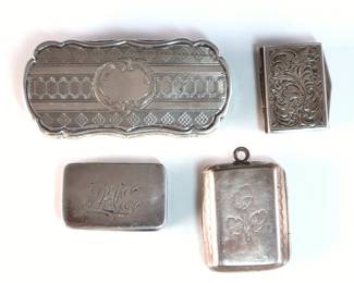 Four 19th century English and German Sterling Silver vinaigrettes. Rectangular hinged boxes with engraved decoration, includes three English and one German examples. Impressed English hallmarks and "Sterling Germany". 2.07 troy ozs total. Some surface wear, one monogrammed, German one lacks insert. Up to 2 1/4" long.