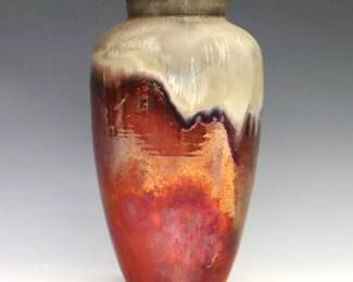 A mid 20th century Ira & Ella Peters for Pewabic Pottery vase. Baluster form with Iridescent Red drip glaze on a matte Golden ground with shades of Pale Green. Faintly "Ira / Ella" signatures. Minor wear. 7 1/2" high.