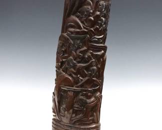 An Oceanic carved ancestral totem or post from Palau. Carved hardwood post depicting emblematic scenes of daily and ceremonial life with multiple figures among palm trees. Refinished with minor wear. 21" high.