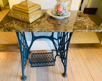 one of three marble top sewing machine tables