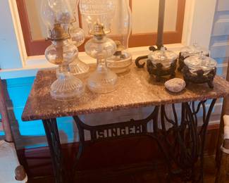 one of three marble top sewing machine tables