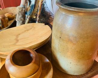 many carved wooden bowls, dough bowls etc and I love the early hand thrown crock