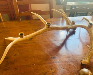 four large deer horns made into candle holders