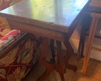 one of two matching marble top end tables