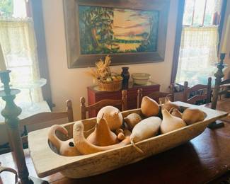 large dough bowl filled with gourds--notice the matching large iron candle sticks--antiques