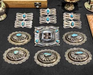 $8,000 - Solid silver and turquoise stone Navajo belt buckle.