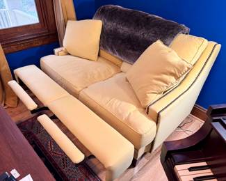 Premium loveseat with electric recliners on both sides. Labels say made in USA, NC.