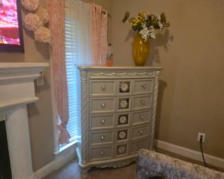 9-drawer chest with floral carvings, metallic champagne finish, and crystal-style pulls. Approx. 44” W x 19” D x 56” H.
