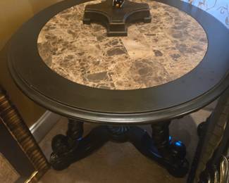 Marble-top round side table with black carved wood base. Excellent condition, sturdy and stylish.