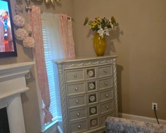 9-drawer chest with floral carvings, metallic champagne finish, and crystal-style pulls. Approx. 44” W x 19” D x 56” H.