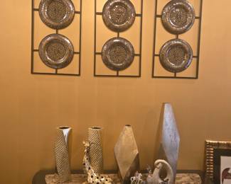 Trio of metal wall art panels featuring circular mosaic-style plates in a sleek black frame. Adds texture and elegance to any space.