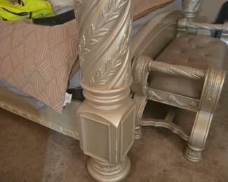 King Canopy Bed – Four-poster design with spiral-carved columns, tufted upholstered headboard, and ornate crown molding. Approx. 86” H x 82” W x 88” L.