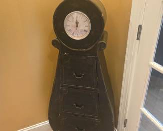Charming vintage-style cabinet with clock face and three drawers. Classic piece for entryway or study. Solid wood construction, minor wear consistent with age.