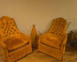 Mid-century style velvet chairs in rich mustard tone with tufted back. Comfortable and stylish, approx. 34” high.