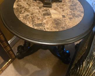 Marble-top round side table with black carved wood base. Excellent condition, sturdy and stylish.