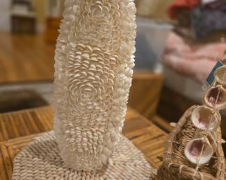 Beautifully detailed shell sculpture with intricate petal-like shell design. Adds a coastal and artistic touch. Approx. 16” tall.