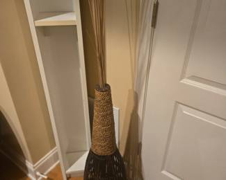 Stylish wicker and rope-wrapped floor vase with natural reed arrangement. Adds earthy texture to any space. Approx. 40” tall.