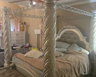 Stunning, high-end five-piece bedroom suite featuring exquisite craftsmanship and rich detailing throughout. King Canopy Bed – Four-poster design with spiral-carved columns, tufted upholstered headboard, and ornate crown molding. Approx. 86” H x 82” W x 88” L.