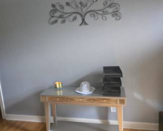 Elegant silver console table with mirrored trim and drawer detail. Perfect for entryway or living room décor.