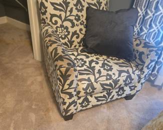 Chic armchair in cream and black floral upholstery. Comfortable and stylish with solid wood legs.
Approx. 34”W x 32”D x 36”H.