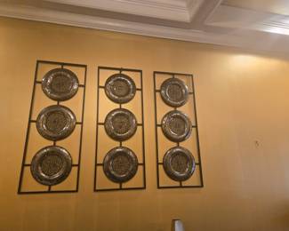 Trio of metal wall art panels featuring circular mosaic-style plates in a sleek black frame. Adds texture and elegance to any space.