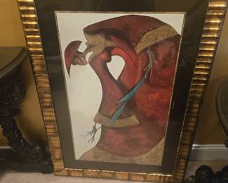 Large framed abstract painting in rich red and gold tones with a textured gold border.